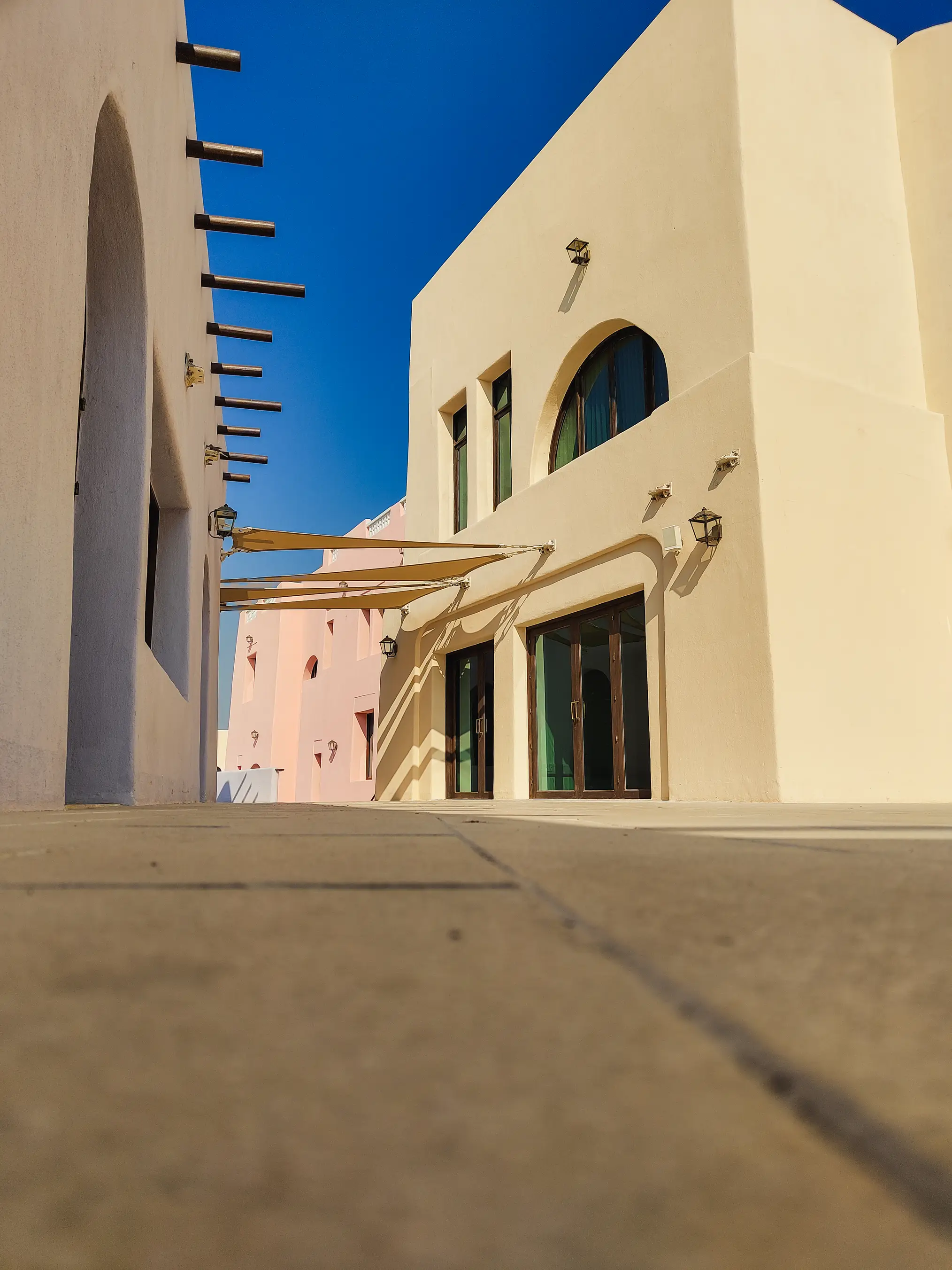 A shot from the ground showing the alleys in Mina District.