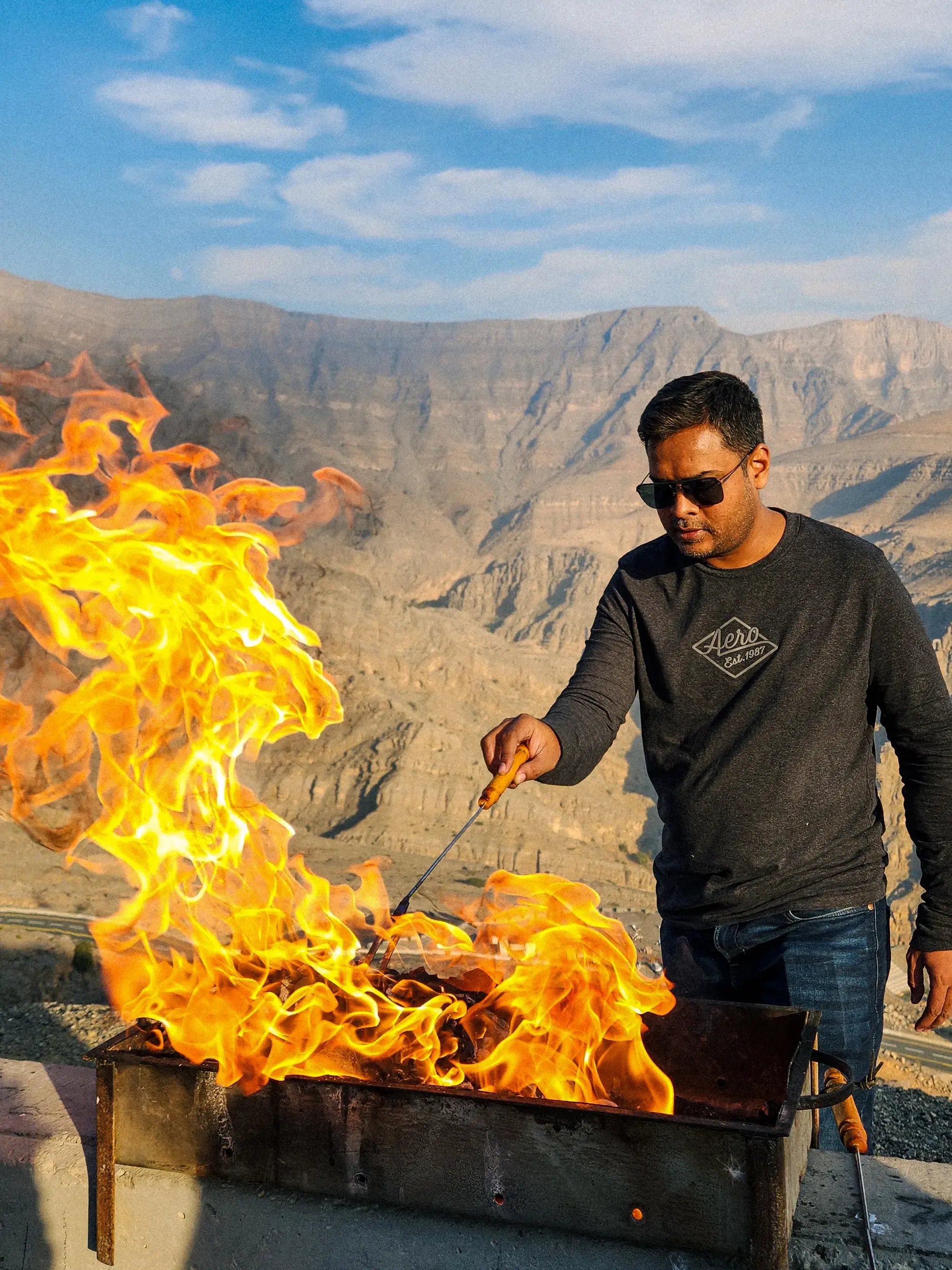 A shot of my father grilling steaks.